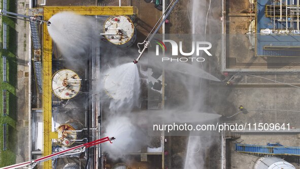 Firefighters participate in a rescue drill at a chemical company in Huai'an, Jiangsu province, China, on August 25, 2024. 