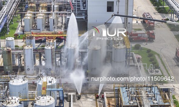 Firefighters participate in a rescue drill at a chemical company in Huai'an, Jiangsu province, China, on August 25, 2024. 