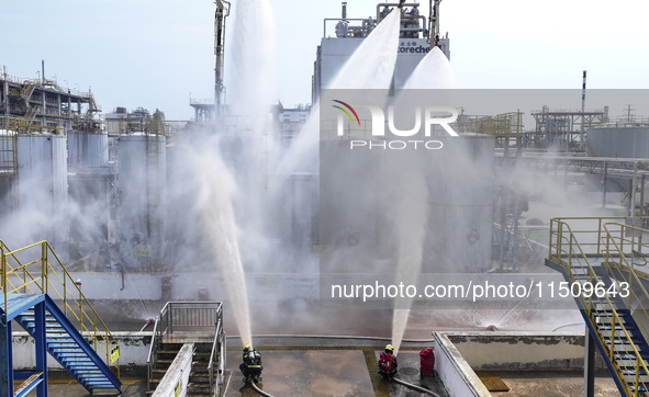 Firefighters participate in a rescue drill at a chemical company in Huai'an, Jiangsu province, China, on August 25, 2024. 