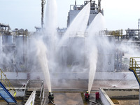 Firefighters participate in a rescue drill at a chemical company in Huai'an, Jiangsu province, China, on August 25, 2024. (