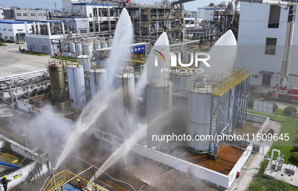 Firefighters participate in a rescue drill at a chemical company in Huai'an, Jiangsu province, China, on August 25, 2024. 