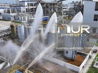 Firefighters participate in a rescue drill at a chemical company in Huai'an, Jiangsu province, China, on August 25, 2024. (