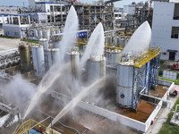 Firefighters participate in a rescue drill at a chemical company in Huai'an, Jiangsu province, China, on August 25, 2024. (