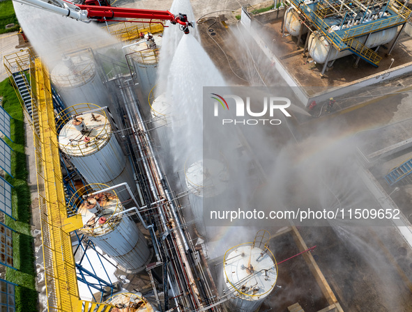 Firefighters participate in a rescue drill at a chemical company in Huai'an, Jiangsu province, China, on August 25, 2024. 