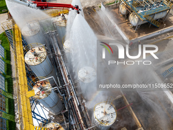 Firefighters participate in a rescue drill at a chemical company in Huai'an, Jiangsu province, China, on August 25, 2024. (