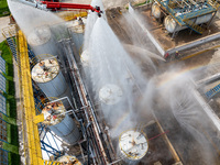 Firefighters participate in a rescue drill at a chemical company in Huai'an, Jiangsu province, China, on August 25, 2024. (