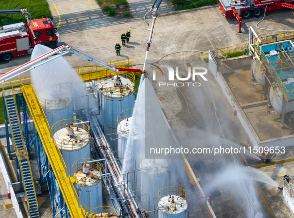 Firefighters participate in a rescue drill at a chemical company in Huai'an, Jiangsu province, China, on August 25, 2024. 