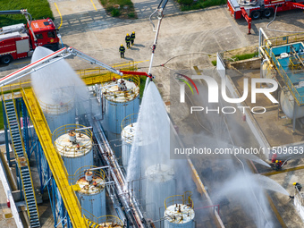 Firefighters participate in a rescue drill at a chemical company in Huai'an, Jiangsu province, China, on August 25, 2024. (