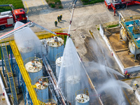 Firefighters participate in a rescue drill at a chemical company in Huai'an, Jiangsu province, China, on August 25, 2024. (