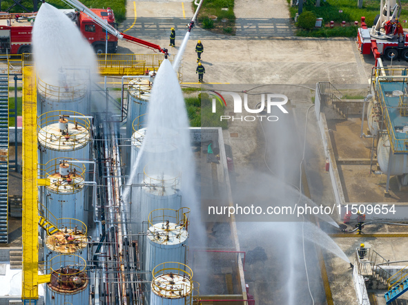 Firefighters participate in a rescue drill at a chemical company in Huai'an, Jiangsu province, China, on August 25, 2024. 