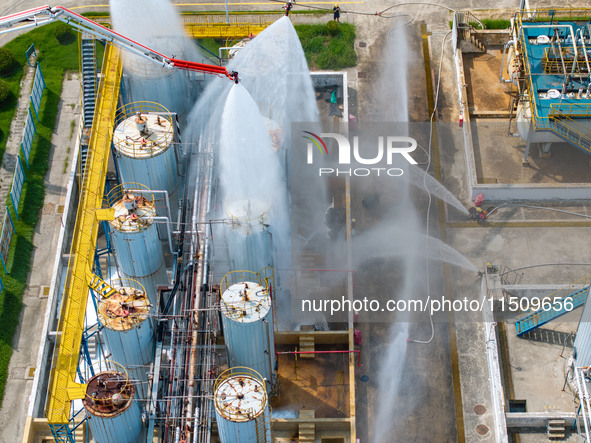 Firefighters participate in a rescue drill at a chemical company in Huai'an, Jiangsu province, China, on August 25, 2024. 