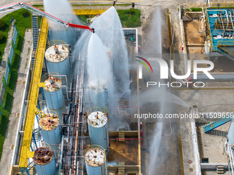 Firefighters participate in a rescue drill at a chemical company in Huai'an, Jiangsu province, China, on August 25, 2024. (