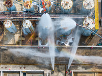 Firefighters participate in a rescue drill at a chemical company in Huai'an, Jiangsu province, China, on August 25, 2024. (