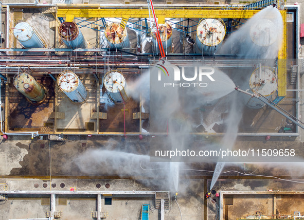 Firefighters participate in a rescue drill at a chemical company in Huai'an, Jiangsu province, China, on August 25, 2024. 