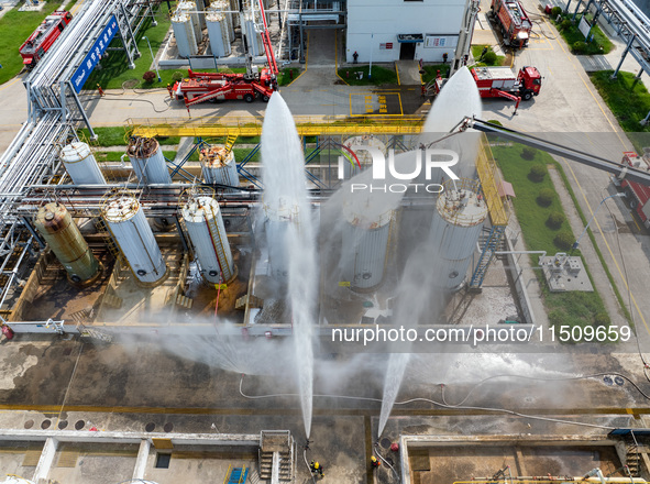 Firefighters participate in a rescue drill at a chemical company in Huai'an, Jiangsu province, China, on August 25, 2024. 