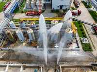 Firefighters participate in a rescue drill at a chemical company in Huai'an, Jiangsu province, China, on August 25, 2024. (