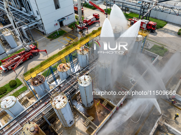 Firefighters participate in a rescue drill at a chemical company in Huai'an, Jiangsu province, China, on August 25, 2024. 