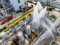 Firefighters participate in a rescue drill at a chemical company in Huai'an, Jiangsu province, China, on August 25, 2024. (