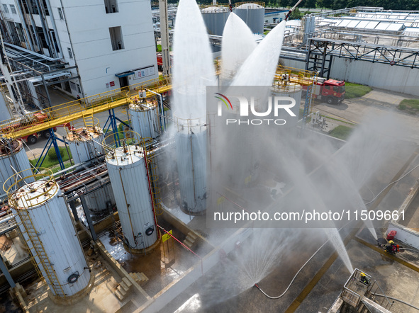 Firefighters participate in a rescue drill at a chemical company in Huai'an, Jiangsu province, China, on August 25, 2024. 