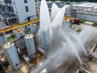 Firefighters participate in a rescue drill at a chemical company in Huai'an, Jiangsu province, China, on August 25, 2024. (