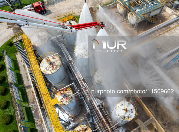 Firefighters participate in a rescue drill at a chemical company in Huai'an, Jiangsu province, China, on August 25, 2024. 