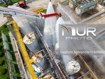 Firefighters participate in a rescue drill at a chemical company in Huai'an, Jiangsu province, China, on August 25, 2024. (