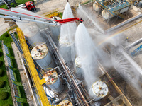 Firefighters participate in a rescue drill at a chemical company in Huai'an, Jiangsu province, China, on August 25, 2024. (