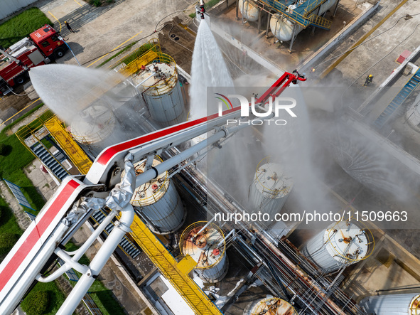 Firefighters participate in a rescue drill at a chemical company in Huai'an, Jiangsu province, China, on August 25, 2024. 