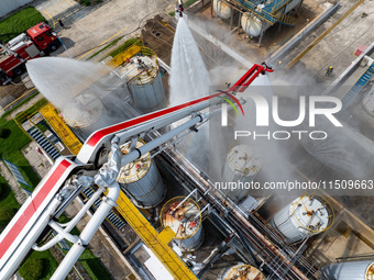 Firefighters participate in a rescue drill at a chemical company in Huai'an, Jiangsu province, China, on August 25, 2024. (