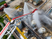 Firefighters participate in a rescue drill at a chemical company in Huai'an, Jiangsu province, China, on August 25, 2024. (