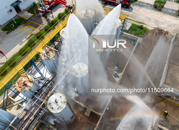 Firefighters participate in a rescue drill at a chemical company in Huai'an, Jiangsu province, China, on August 25, 2024. 