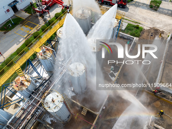 Firefighters participate in a rescue drill at a chemical company in Huai'an, Jiangsu province, China, on August 25, 2024. (