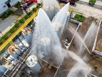 Firefighters participate in a rescue drill at a chemical company in Huai'an, Jiangsu province, China, on August 25, 2024. (