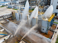 Firefighters participate in a rescue drill at a chemical company in Huai'an, Jiangsu province, China, on August 25, 2024. (