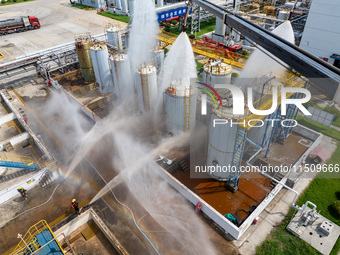 Firefighters participate in a rescue drill at a chemical company in Huai'an, Jiangsu province, China, on August 25, 2024. (