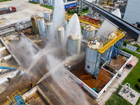 Firefighters participate in a rescue drill at a chemical company in Huai'an, Jiangsu province, China, on August 25, 2024. (