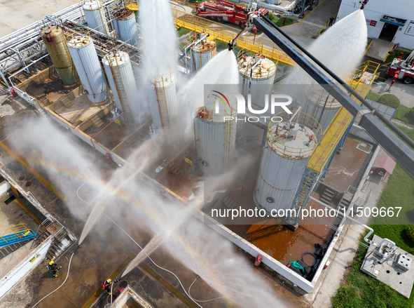 Firefighters participate in a rescue drill at a chemical company in Huai'an, Jiangsu province, China, on August 25, 2024. 