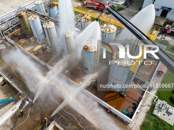 Firefighters participate in a rescue drill at a chemical company in Huai'an, Jiangsu province, China, on August 25, 2024. (