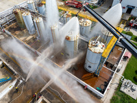 Firefighters participate in a rescue drill at a chemical company in Huai'an, Jiangsu province, China, on August 25, 2024. (