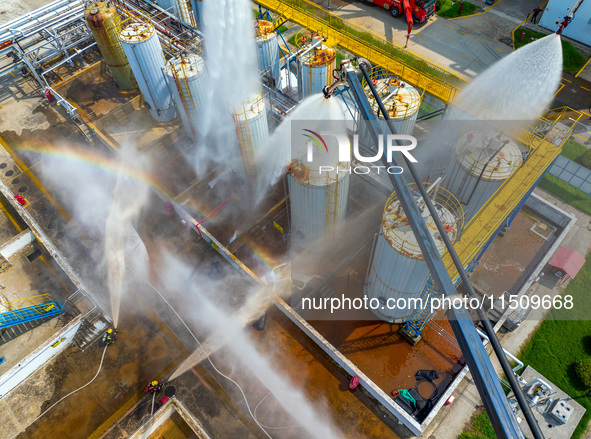 Firefighters participate in a rescue drill at a chemical company in Huai'an, Jiangsu province, China, on August 25, 2024. 