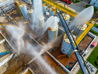 Firefighters participate in a rescue drill at a chemical company in Huai'an, Jiangsu province, China, on August 25, 2024. (