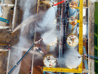 Firefighters participate in a rescue drill at a chemical company in Huai'an, Jiangsu province, China, on August 25, 2024. (