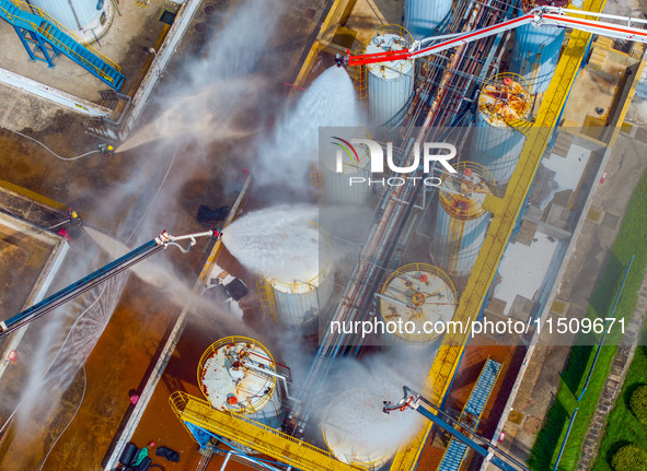 Firefighters participate in a rescue drill at a chemical company in Huai'an, Jiangsu province, China, on August 25, 2024. 