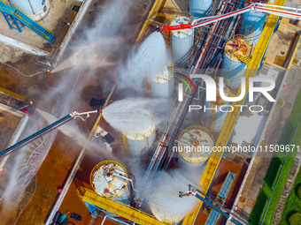 Firefighters participate in a rescue drill at a chemical company in Huai'an, Jiangsu province, China, on August 25, 2024. (