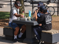 People play chess at Nathan Philips Square in downtown Toronto, Ontario, Canada, on August 14, 2024. (