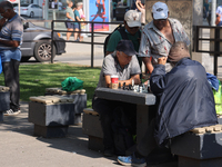 People play chess at Nathan Philips Square in downtown Toronto, Ontario, Canada, on August 14, 2024. (