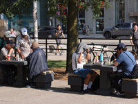 People play chess at Nathan Philips Square in downtown Toronto, Ontario, Canada, on August 14, 2024. (