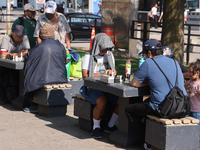 People play chess at Nathan Philips Square in downtown Toronto, Ontario, Canada, on August 14, 2024. (