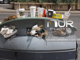 An overflowing garage can in Toronto, Ontario, Canada, on August 24, 2024. (