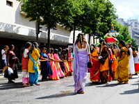 Women pull a chariot during the Ganesh Chaturthi procession, in Paris, France, on August 25, 2024.  (